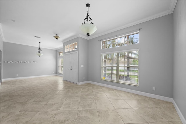 unfurnished room featuring light tile patterned floors and crown molding