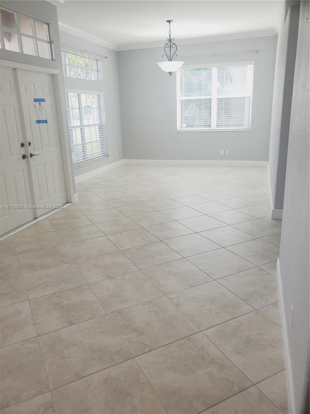 entryway featuring light tile patterned floors and crown molding