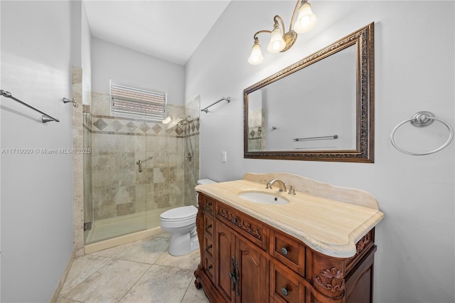 bathroom with tile patterned flooring, toilet, a shower with door, and vanity