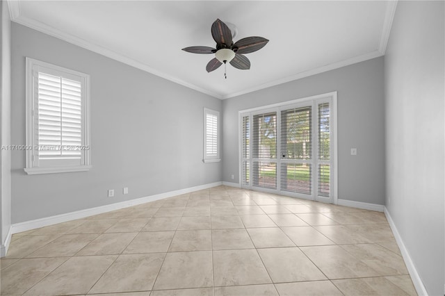 unfurnished room featuring light tile patterned flooring, ceiling fan, a wealth of natural light, and ornamental molding