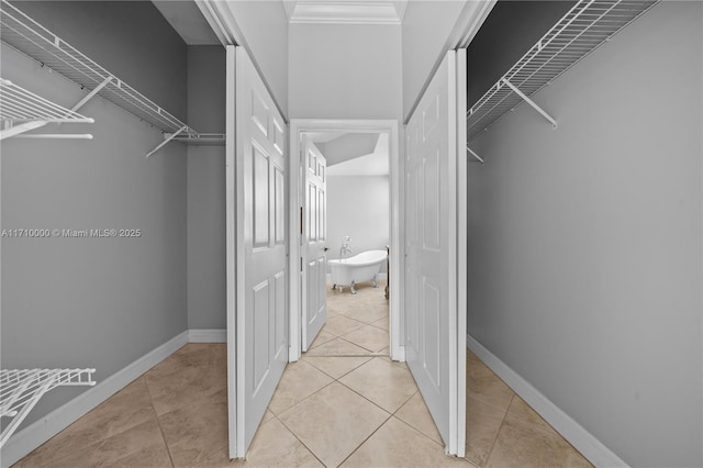 spacious closet featuring light tile patterned floors