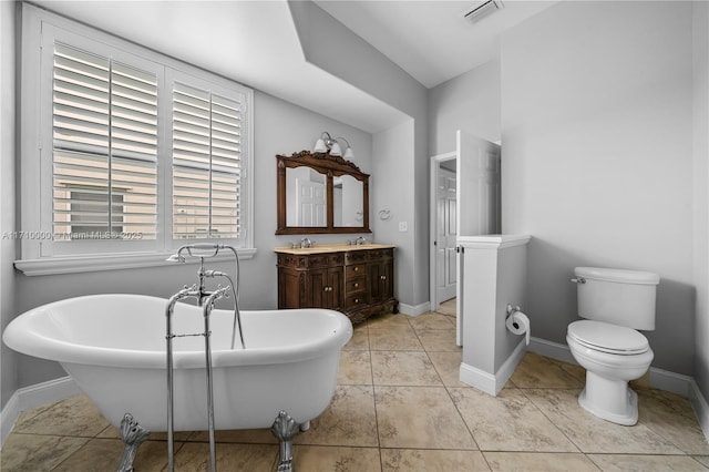 bathroom featuring tile patterned flooring, vanity, and a bathtub