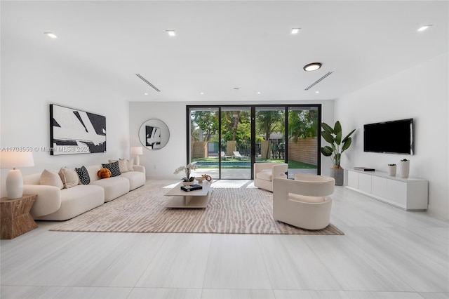 living room with floor to ceiling windows