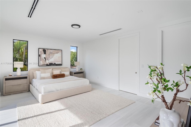 bedroom with light wood-type flooring