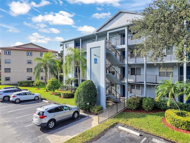 900 SW 125th Way Unit 304R, Pembroke Pines, FL 33027 - view of apartment building / complex with stairway and uncovered parking