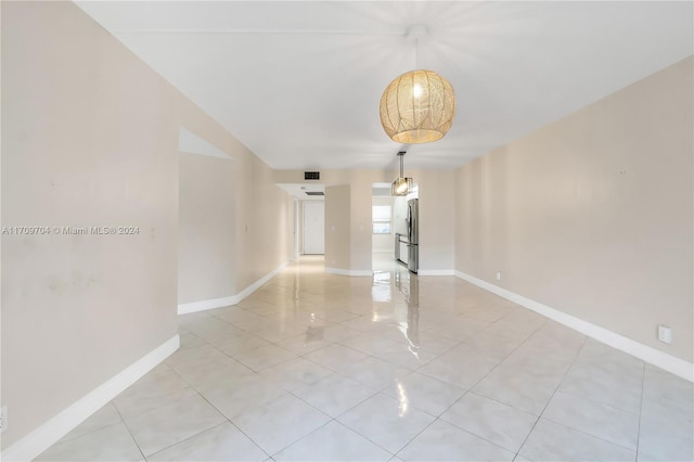 empty room with light tile patterned flooring