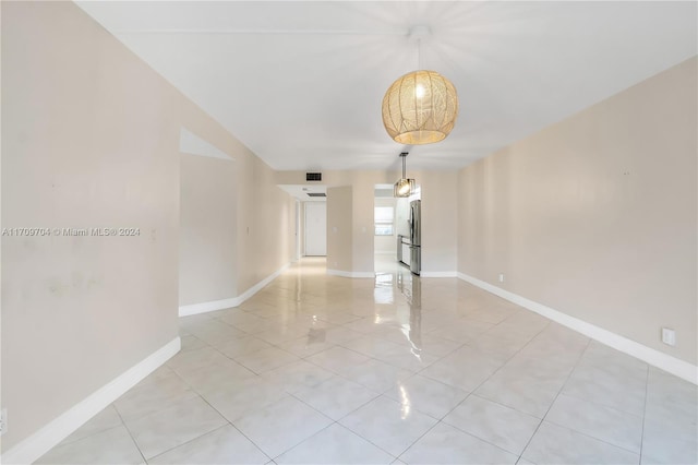 900 SW 125th Way Unit 304R, Pembroke Pines, FL 33027 - empty room featuring light tile patterned floors and baseboards