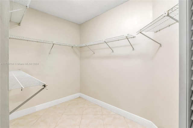 spacious closet featuring tile patterned floors