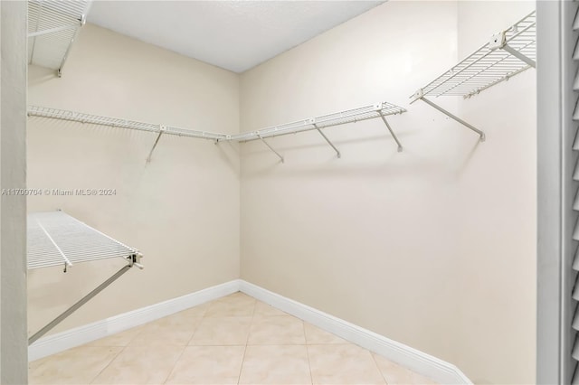 900 SW 125th Way Unit 304R, Pembroke Pines, FL 33027 - spacious closet featuring light tile patterned flooring