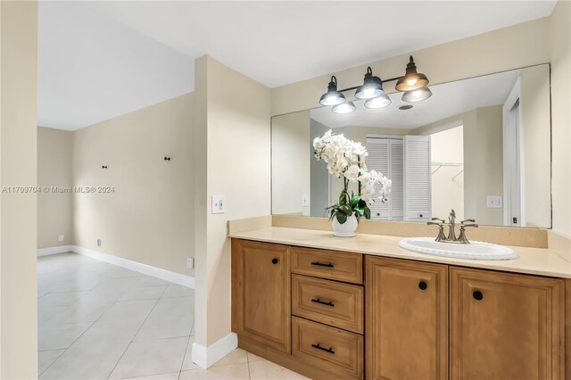 bathroom featuring tile patterned flooring and vanity