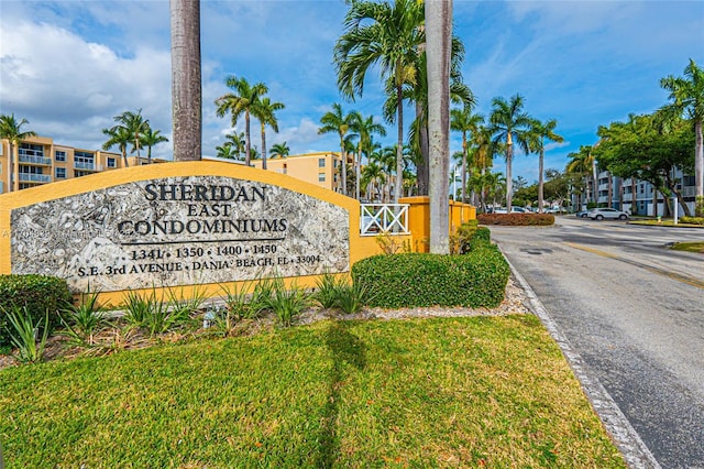 community / neighborhood sign with a lawn