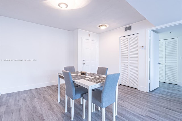 dining space featuring hardwood / wood-style floors