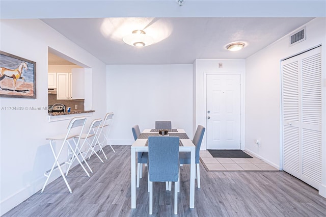 dining space featuring light hardwood / wood-style floors