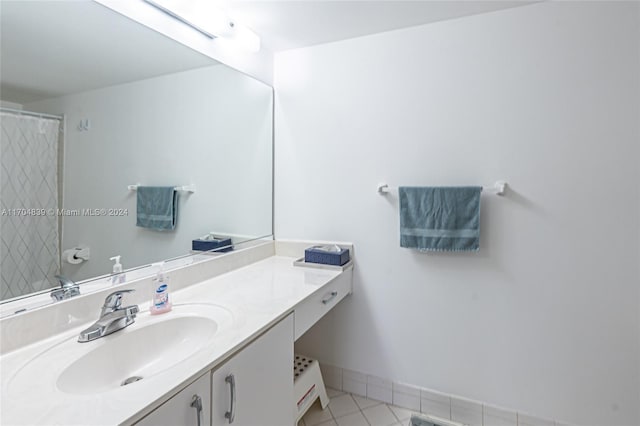 bathroom featuring tile patterned flooring and vanity