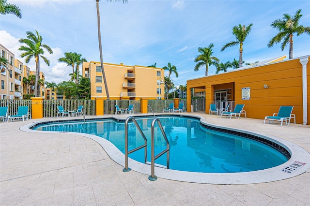 view of swimming pool with a patio