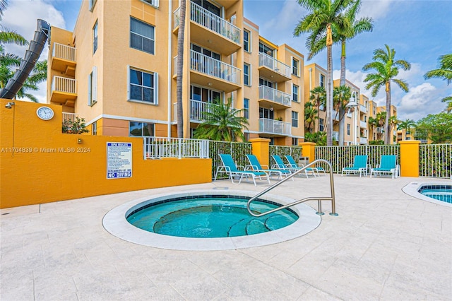 view of pool featuring a hot tub