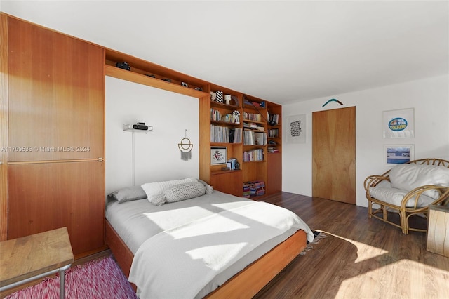 bedroom featuring dark wood-type flooring