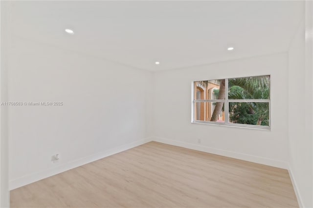 spare room with light hardwood / wood-style floors