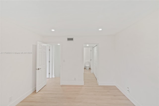 hall with light wood-type flooring