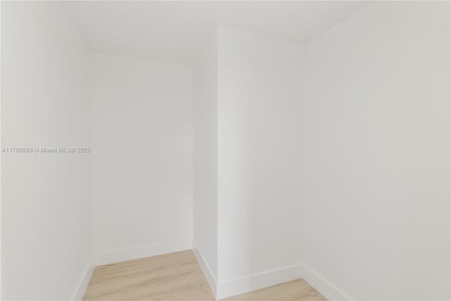 spare room featuring light wood-type flooring