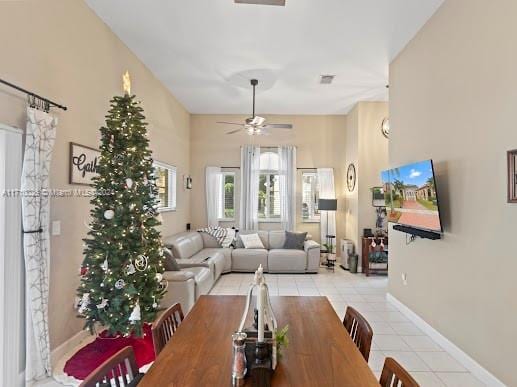 tiled dining room featuring ceiling fan