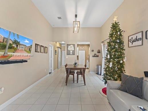 dining space featuring light tile patterned floors