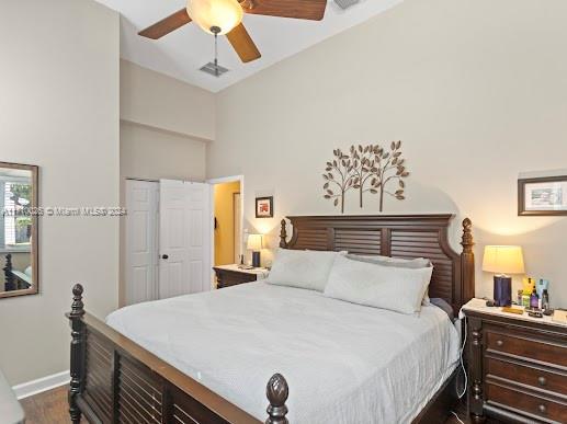 bedroom featuring a closet, ceiling fan, and dark wood-type flooring