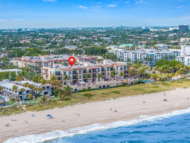 aerial view with a water view and a beach view