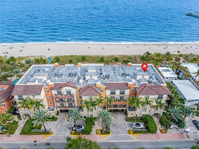 aerial view featuring a water view and a beach view