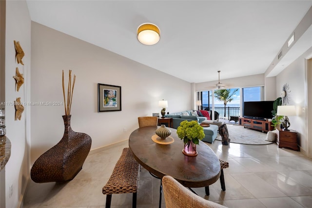 tiled dining room with ceiling fan