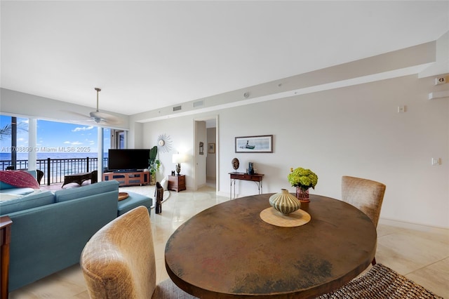 dining room featuring ceiling fan