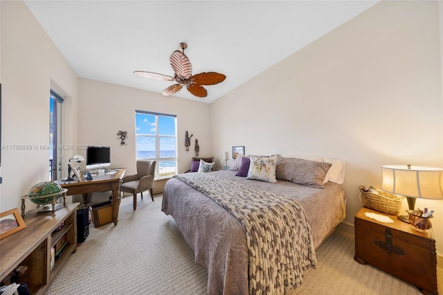 carpeted bedroom featuring ceiling fan and lofted ceiling