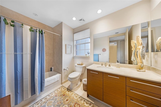 full bathroom featuring tile patterned floors, vanity, toilet, and shower / tub combo with curtain