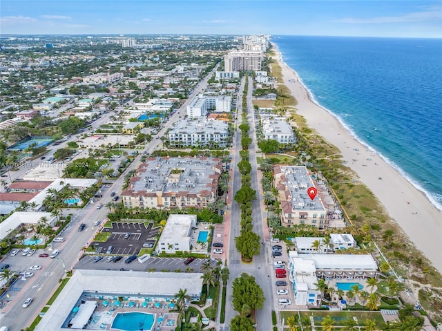 aerial view featuring a water view and a beach view