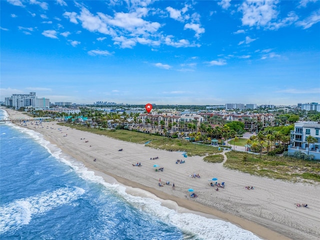 birds eye view of property with a beach view and a water view