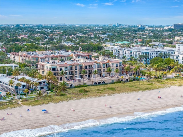 bird's eye view with a water view and a view of the beach