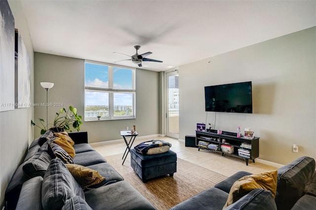 tiled living room featuring ceiling fan