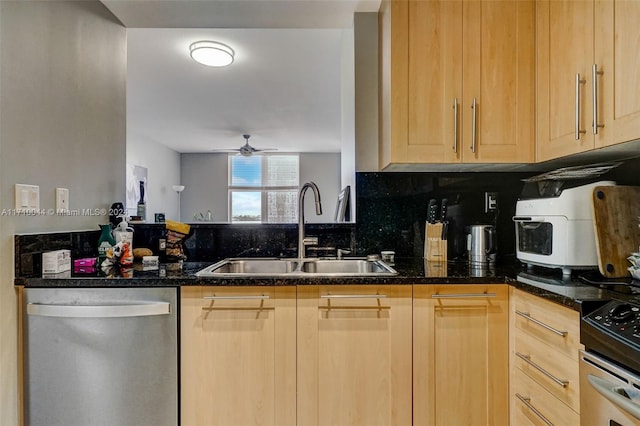 kitchen with light brown cabinets, stainless steel appliances, ceiling fan, and sink