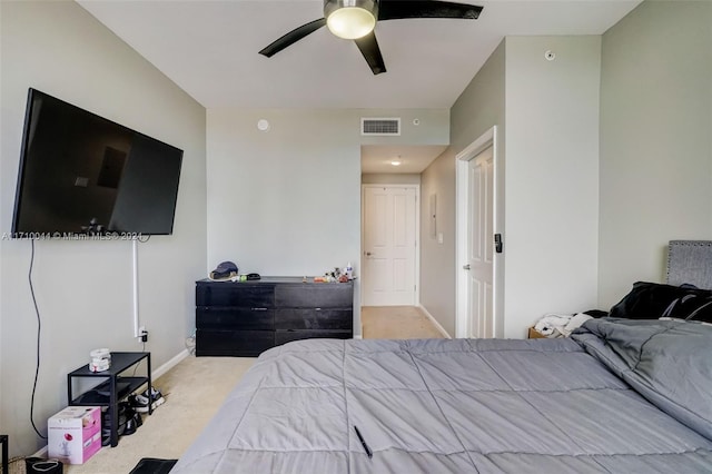 bedroom with ceiling fan and light carpet