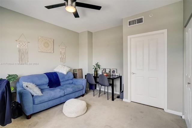 living room featuring ceiling fan and light colored carpet