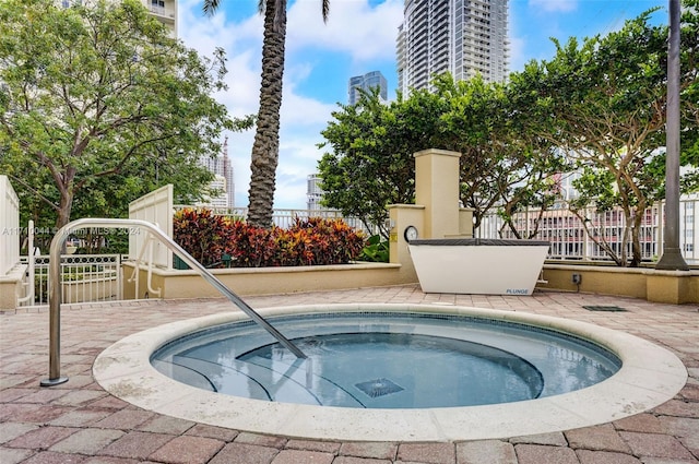 view of pool featuring a community hot tub