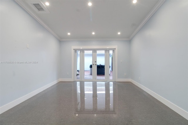 spare room with ornamental molding and french doors