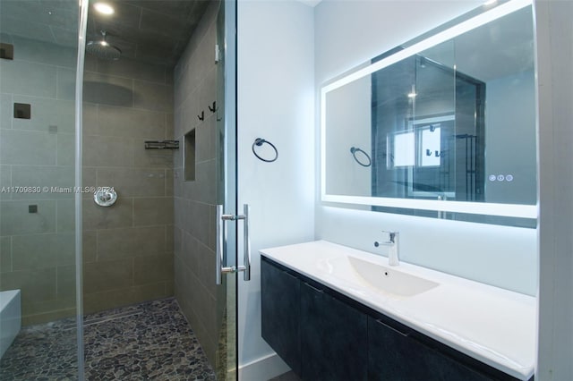 bathroom with vanity and walk in shower