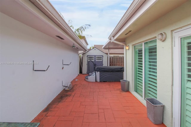 view of patio / terrace featuring a storage shed