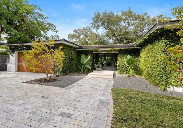 view of front facade with french doors and a garage