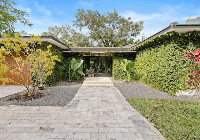 exterior space featuring french doors and a garage