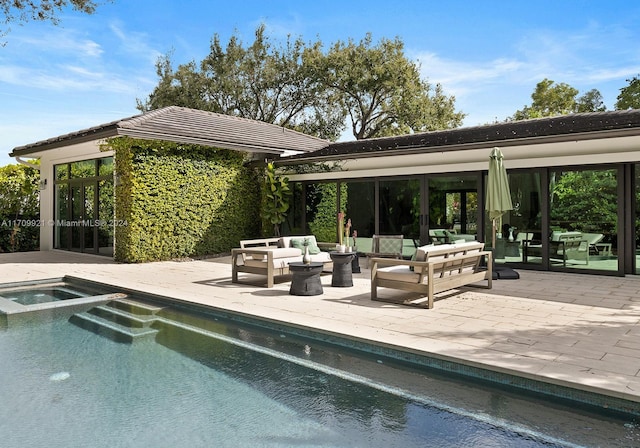 view of swimming pool with an in ground hot tub, a patio, and an outdoor hangout area