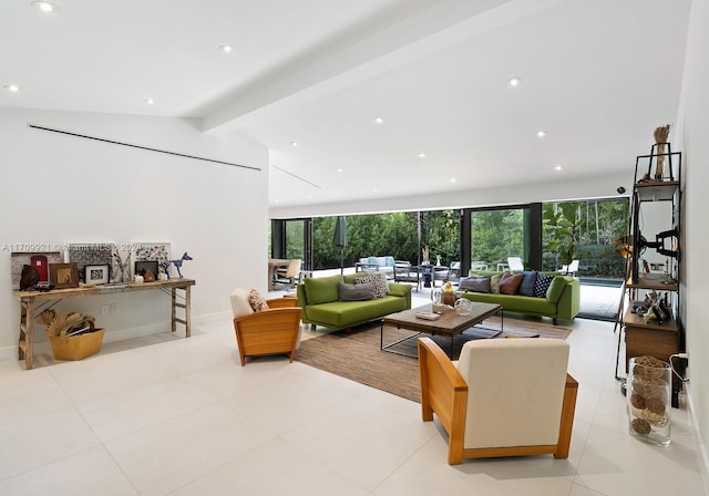 living room featuring lofted ceiling with beams, a healthy amount of sunlight, and light tile patterned floors