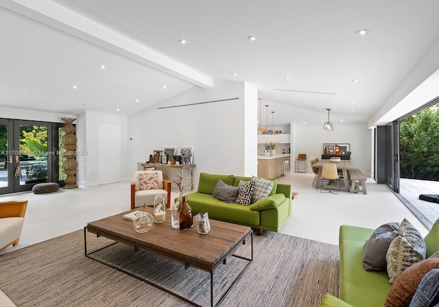 living room with vaulted ceiling with beams and french doors