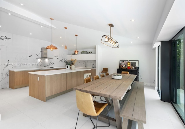 dining area with sink and a wall of windows